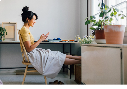 Lady sitting at desk on phone
